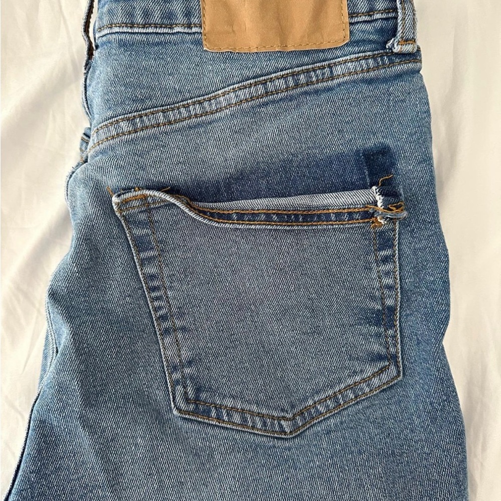 pocket is torn a little, have a distressed ankle, run small